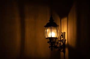 Old fashioned wall mounted light in a wooden room